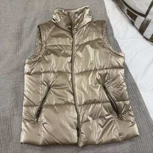 Gold puffer vest. Very cute oversized with some leggings.